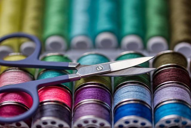 textile learning resources notebook fabric swatches and sewing tools on tidy desk